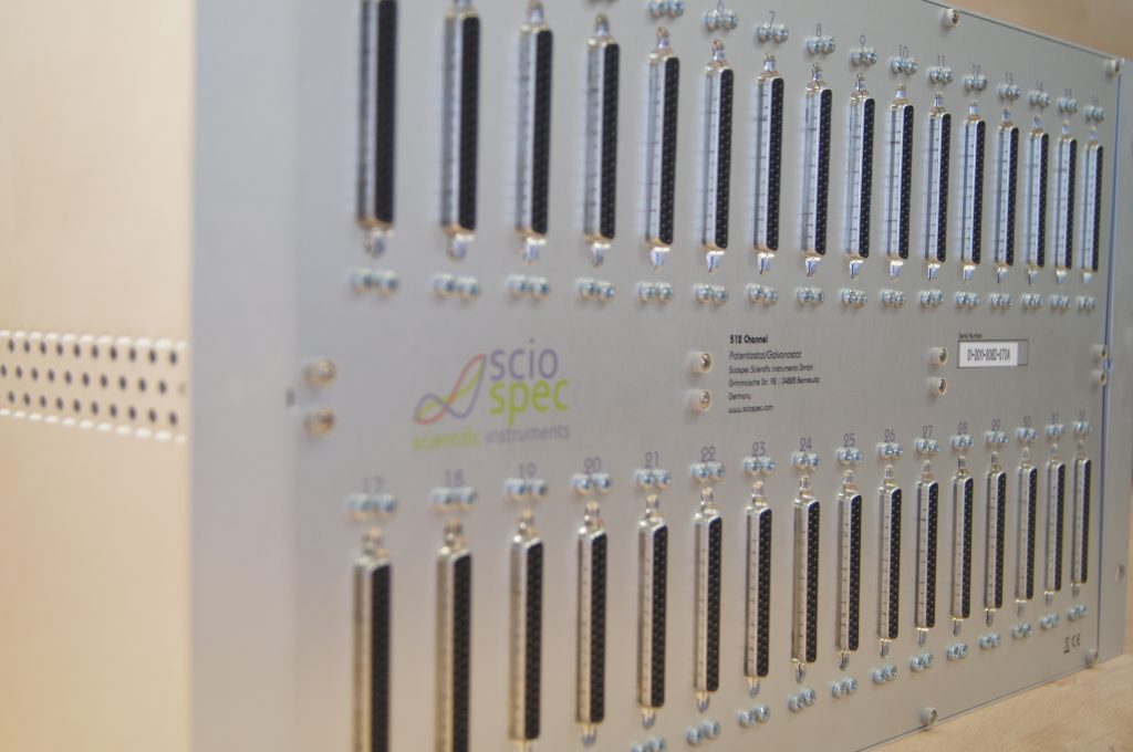 512-channel Sciospec impedance testing system integrated for high-throughput microbattery testing.